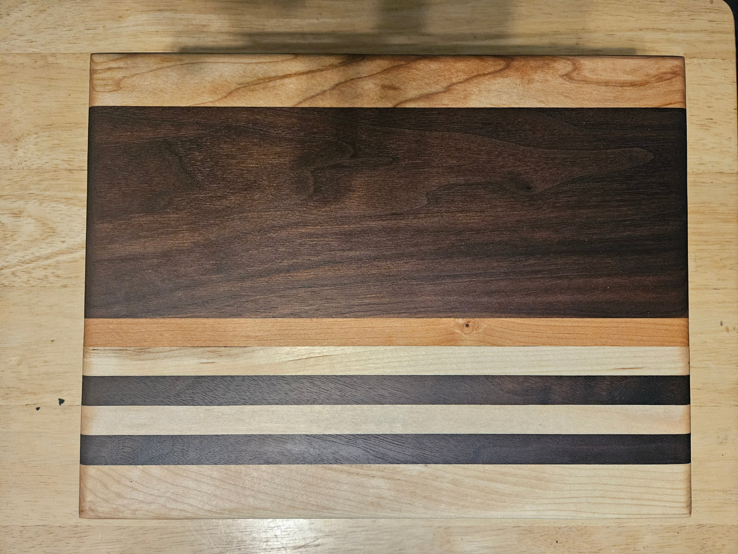 Cutting/Vegetable Board made w/ Walnut, cherry and Maple with finger grips 11" x 9"