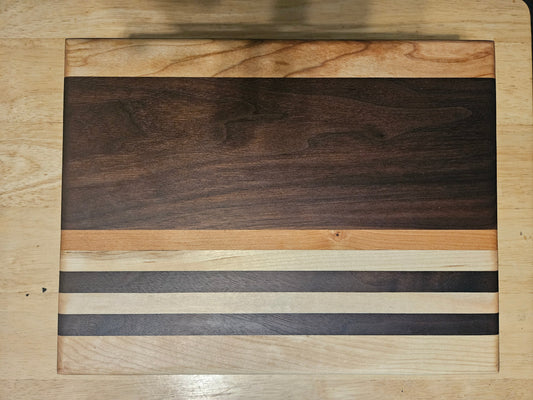 Cutting/Vegetable Board made w/ Walnut, cherry and Maple with finger grips 11" x 9"
