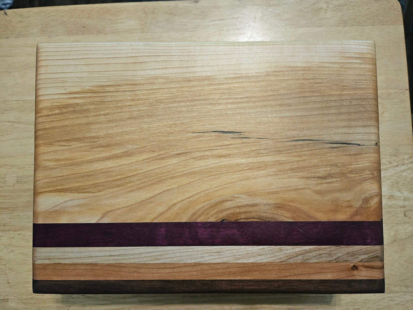 Cutting/Vegetable Board made w/ Walnut, Maple, cherry and Purple Heart with finger grips 11" x 9"
