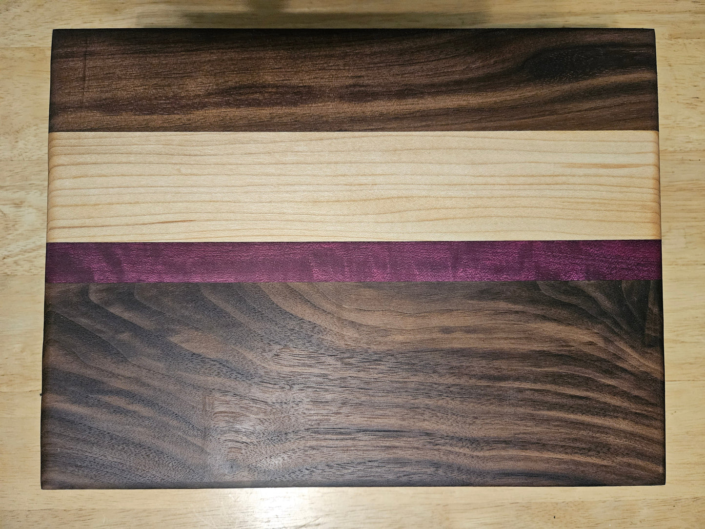 Cutting/Vegetable Board made w/ Walnut, Maple and Purple Heart with finger grips 11" x 9"