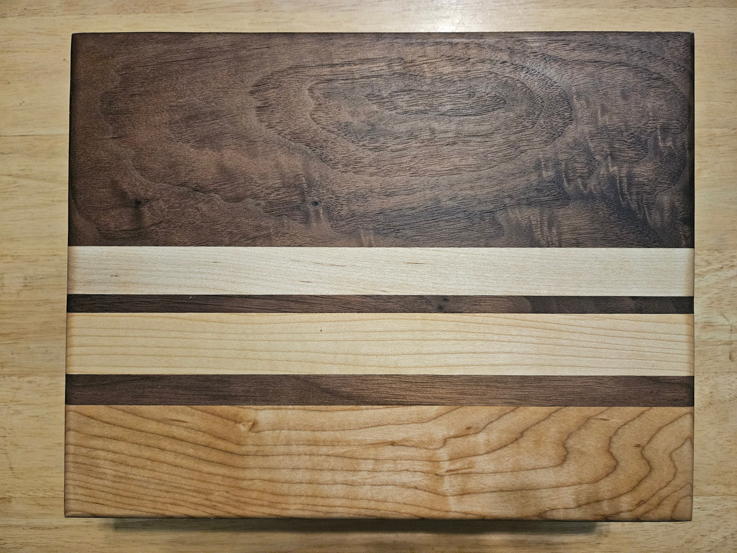 Cutting/Vegetable Board made w/ Walnut, cherry and Maple with finger grips 11" x 9"