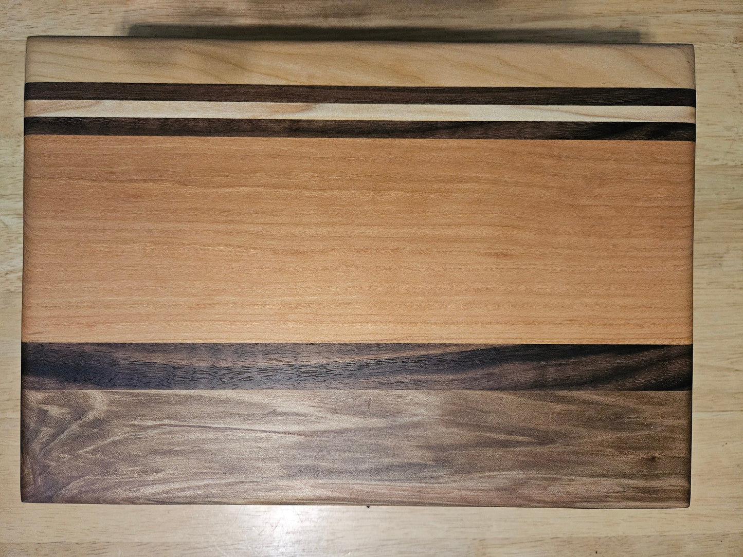 Cutting/Vegetable Board made w/ Walnut, cherry and Maple with finger grips 11" x 9"