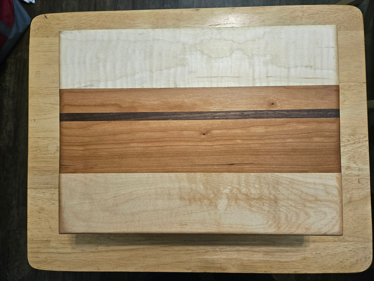 Cutting/Vegetable Board made w/ Walnut, cherry and Maple with finger grips 12" x 9"
