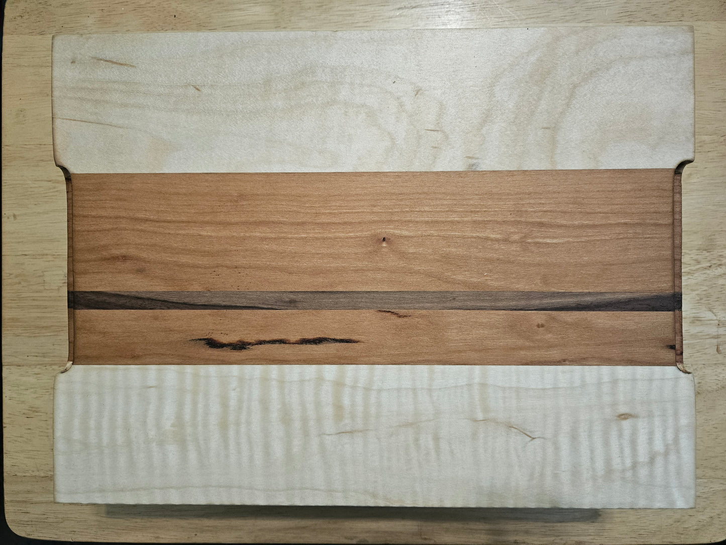 Cutting/Vegetable Board made w/ Walnut, cherry and Maple with finger grips 12" x 9"
