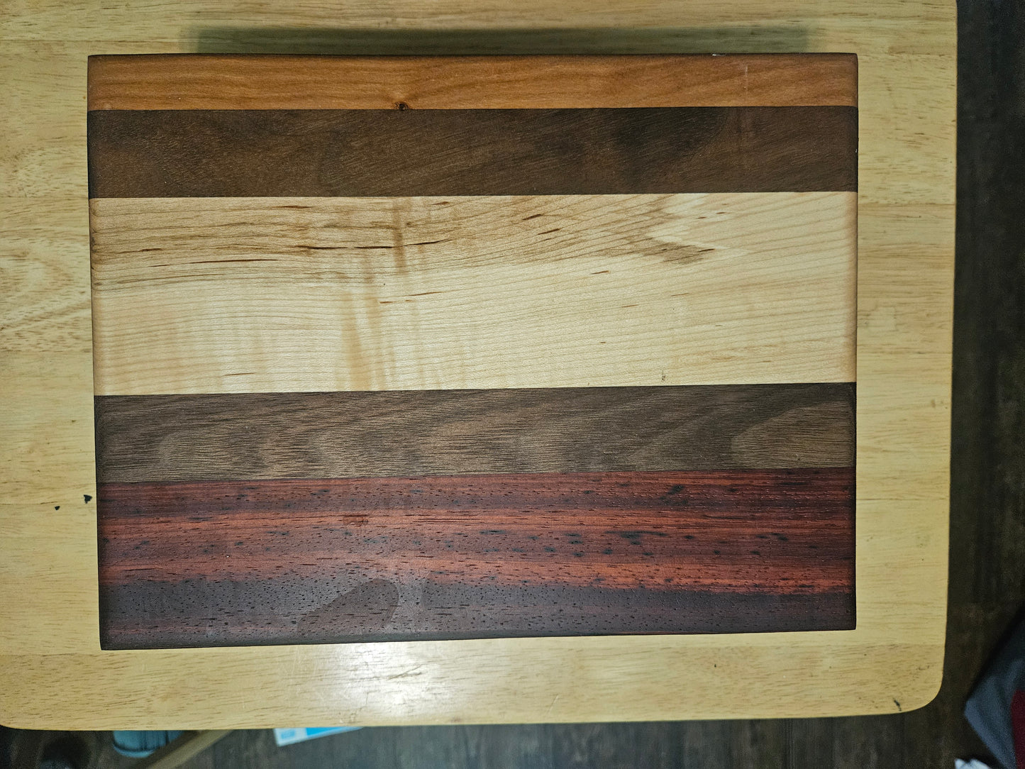 Cutting/Vegetable Board made w/ Walnut, Maple, Cherry and Paduak with finger grips 11" x 9"