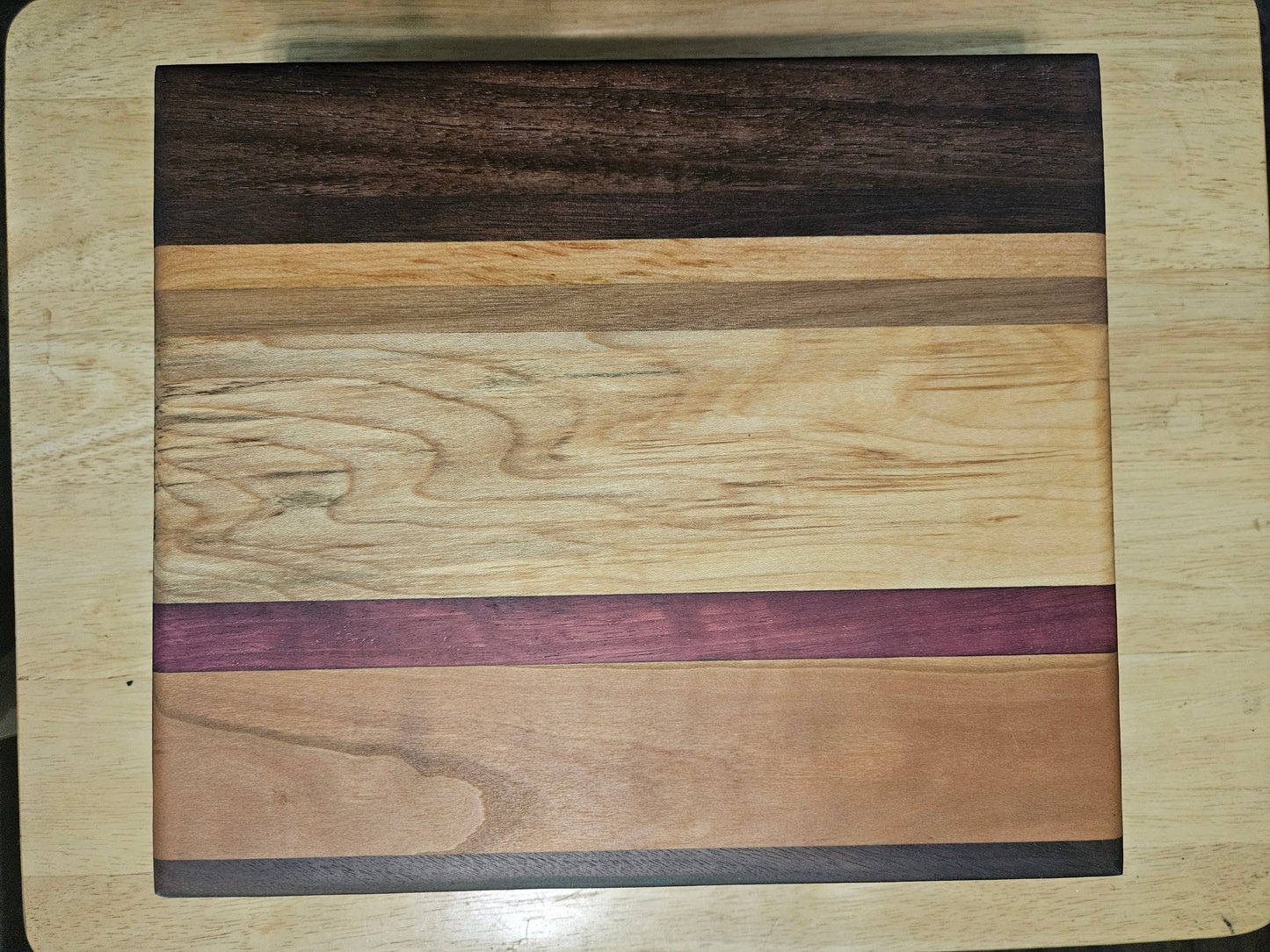 Cutting/Vegetable Board made w/ Walnut, Maple, Cherry and Purple Heart with finger grips 11" x 9"