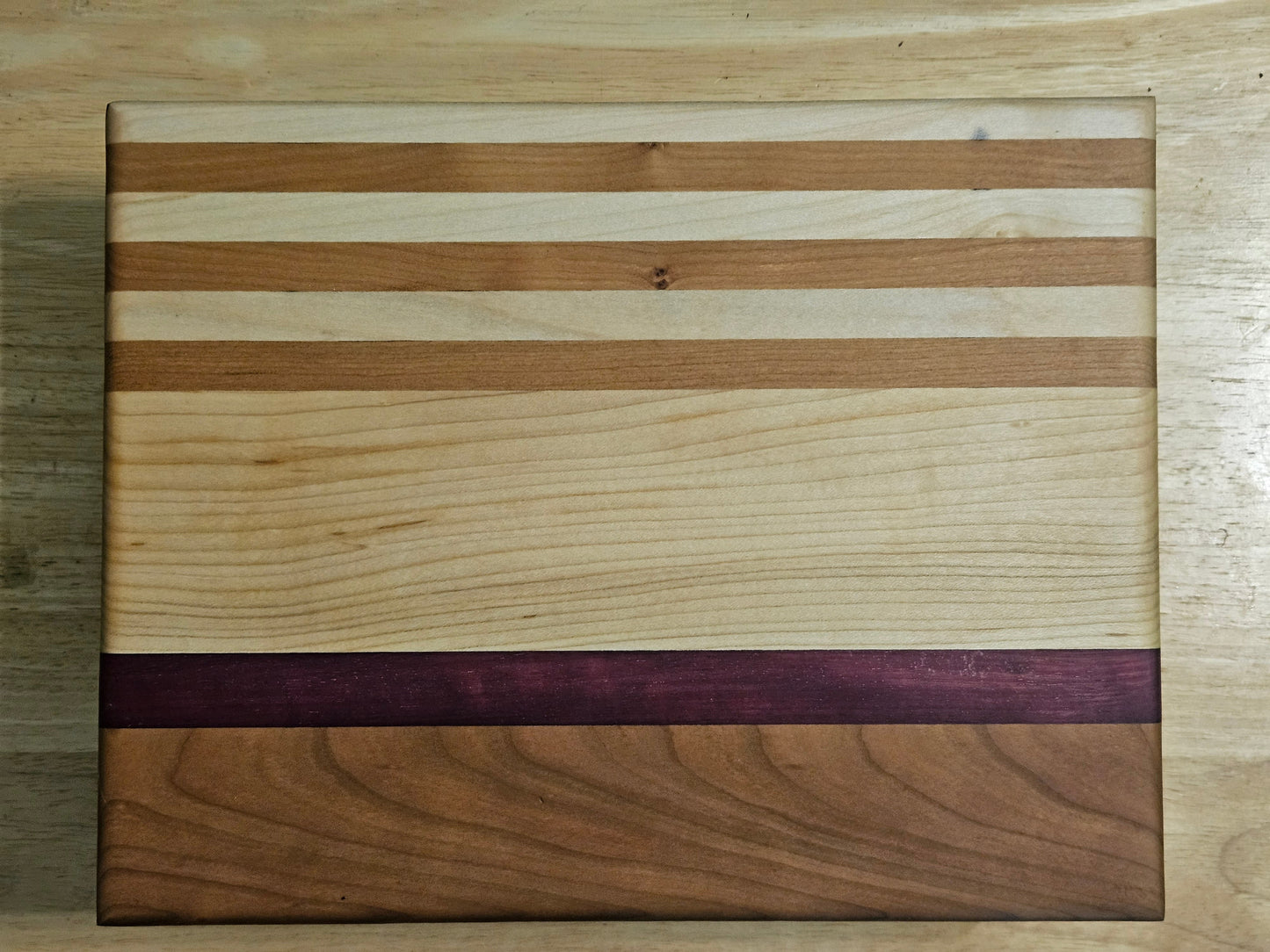 Cutting/Vegetable Board made w/ Walnut, Maple and Purple Heart with finger grips 11" x 8.5"