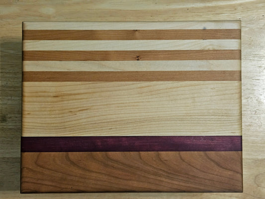 Cutting/Vegetable Board made w/ Walnut, Maple and Purple Heart with finger grips 11" x 8.5"